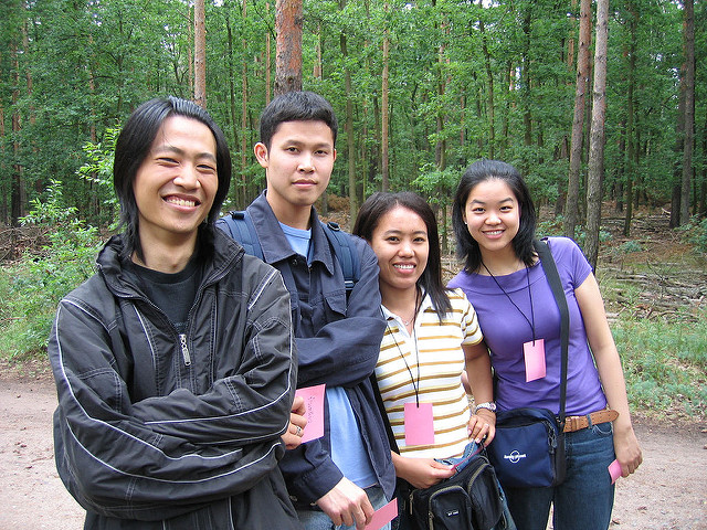 Image 8: A group of people outdoors who look very similar.